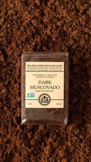 India Tree Sugars - Dark Muscovado, in elegant packaging, showcasing a black and white floral design, epitomizes gourmet quality for enhancing culinary creations.