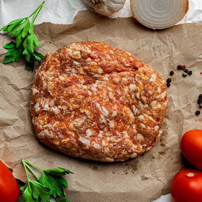 Close-up of Rock House Creamery's Sweet Italian Sausage, 1 lb. Ground, showcasing its marbled texture, made from pasture-raised Berkshire pork, highlighted by a housemade Italian spice blend.