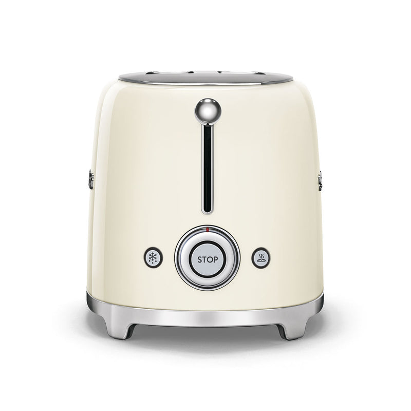 Smeg | 2 Slice Toaster - Cream, featuring dual slots, chrome trim, lever, and buttons for stop, defrost, and reheat. Compact design for versatile toasting.