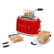Smeg | Toaster - Red with chrome racks holding toasted bread and sandwiches, featuring a silver control knob and lever, displayed by Athens Cooks.