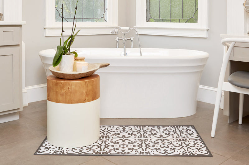 Etú HOME | Liberty L Italian Kitchen Sink Floor Mat (24x47) with a black-and-white pattern enhances a modern bathroom, adding Italian design charm and functionality.