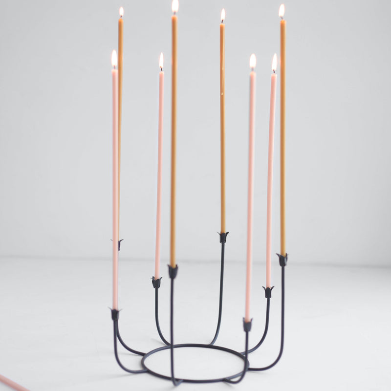The Floral Society | Long Stem Beeswax Candles, Blossom, elegantly displayed in a minimalist black candelabra, showcasing their warm, smoke-free glow.