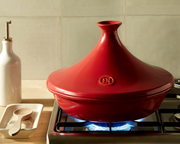 Emile Henry | Spoon Rest, Truffle, elegantly displayed on a wooden countertop, offers a functional, stylish solution for keeping utensils organized and counters clean.