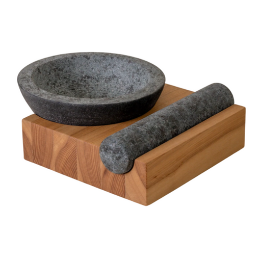 Holcomb Studio | Perch Mortar & Pestle: A textured granite mortar with a rolling pin, ideal for grinding spices, positioned on a wooden surface, showcasing its sturdy design.