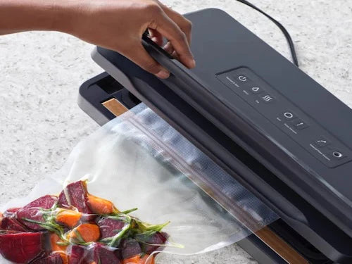 Anova | Precision Vacuum Sealer Pro with high power vacuum, double sealer, built-in bag storage, cutter, and accessory port, ideal for sealing wet foods effortlessly.