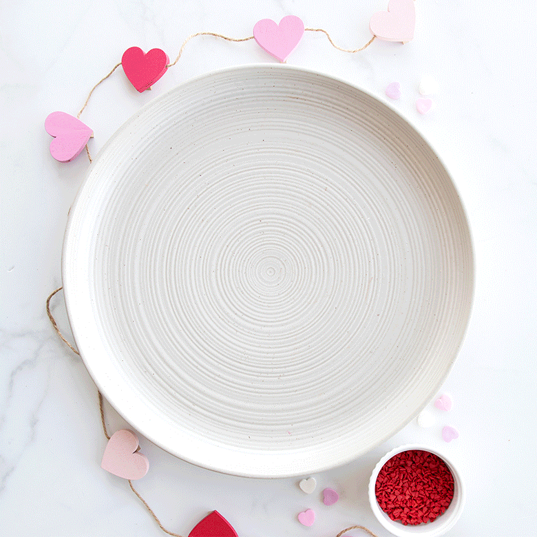Nordic Ware | Bundt® Tea Cakes and Candies Pan on a plate, featuring heart shapes for crafting detailed mini cakes and candies.