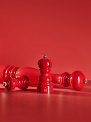 Peugeot | Paris Chef u'Select Passion Red Pepper Mill, 12 inches, featuring a classic silhouette and adjustable grind, elegantly displayed with two additional mills.
