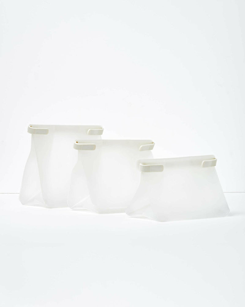 W&P | Roll Tight Storage Bags - Assorted Set of 3, featuring bendable crimping bars for airtight storage, visible contents, and reusable, compact design for freezer, fridge, or pantry organization.