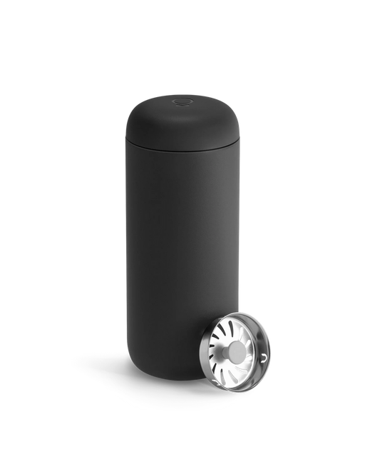 FELLOW | Carter Move Mug, Matte Black, 16 oz, shown with a push-down ashtray, highlighting its sleek design for on-the-go coffee enjoyment.