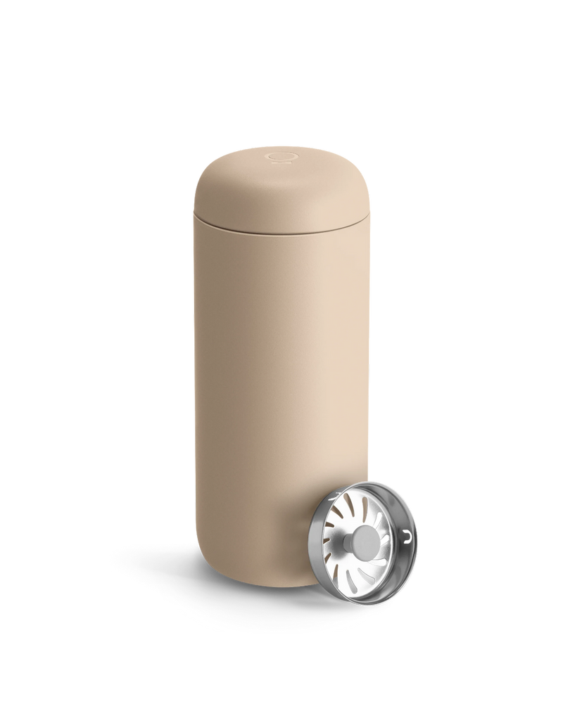 FELLOW Carter Move Mug, Sand Dune, 16 oz, featuring a double-walled tumbler with lid and stainless-steel brew basket, ideal for portable coffee or tea brewing.