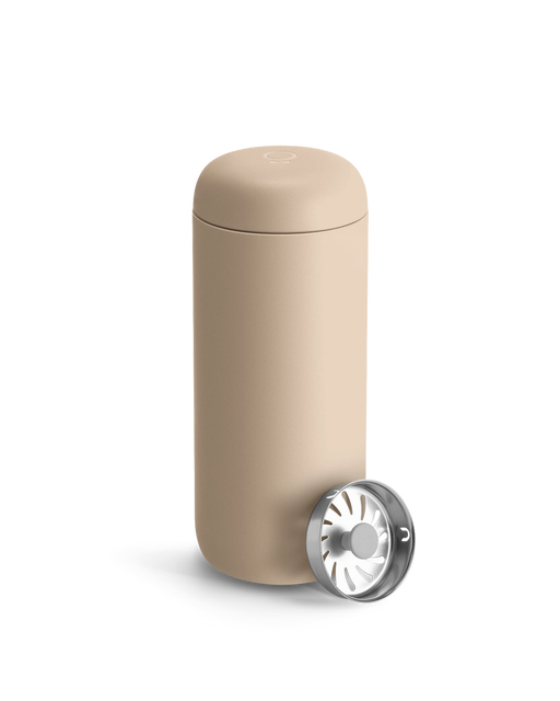 FELLOW Carter Move Mug, Sand Dune, 16 oz, featuring a double-walled tumbler with lid and stainless-steel brew basket, ideal for portable coffee or tea brewing.