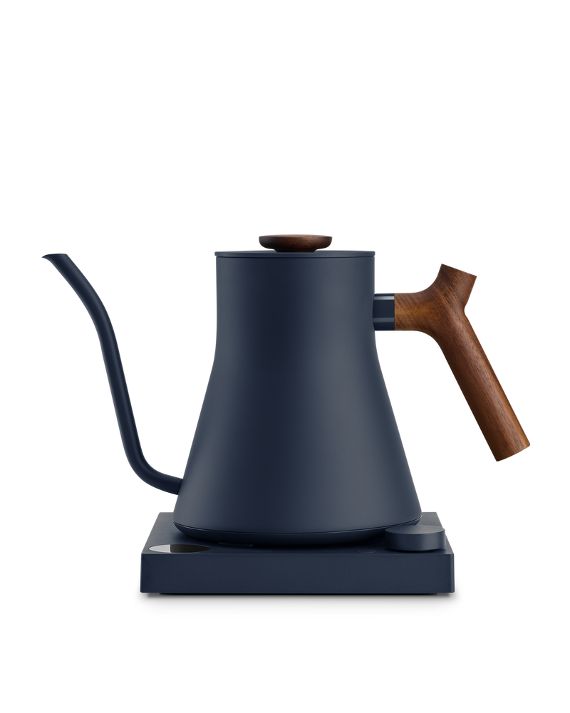 FELLOW | Stagg EKG Pro Electric Kettle, Stone Blue w/ Walnut. Features a precision spout, wooden accents, and a temperature-control base, ideal for pour-over coffee.