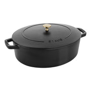 Staub Wide Oval Dutch Oven - Graphite Grey, ideal for braising and roasting, features enameled cast iron with a self-basting lid for optimal moisture retention.