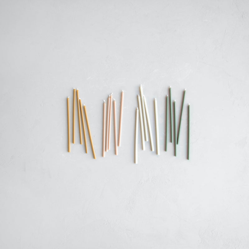 The Floral Society | Wishing Candles, Miel: A serene arrangement of pastel-hued taper candles, ideal for elevating everyday rituals or special gatherings with warmth and elegance.