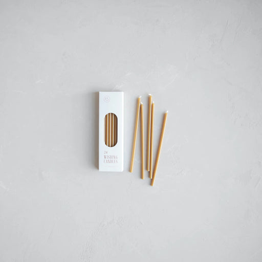 The Floral Society | Wishing Candles, Miel: A minimal flat lay shows a box of 24 slim candles with six displayed, perfect for celebratory moments.