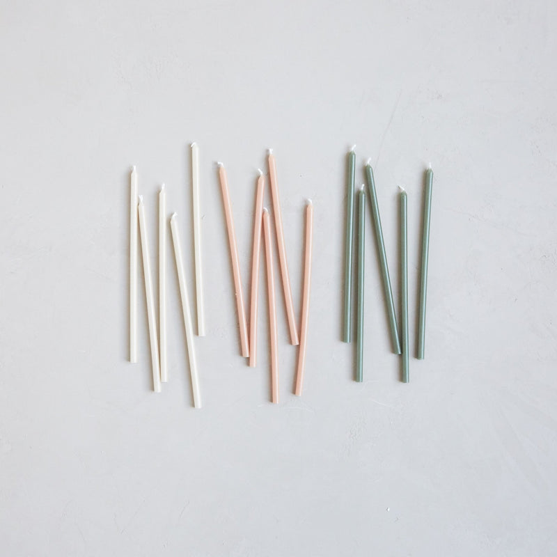 The Floral Society | Wishing Candles, Miel: A set of unlit taper candles in off-white, soft pink, and sage green, ideal for enhancing everyday moments or special gatherings.