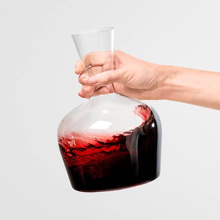 Richard Brendon | Jancis Robinson Young Wine Decanter held in hand, showcasing its elegant glass design suitable for aerating young wines, ideal for dinner parties.