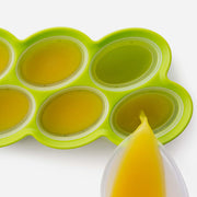 Zoku | Classic Pop Mold shown with a yellow liquid being poured, ideal for making homemade popsicles.