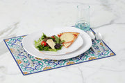 Etú HOME | Positano B Italian Rectangle Vinyl Placemat featuring a stylish pattern, displayed with a plate of food and utensils on a table.