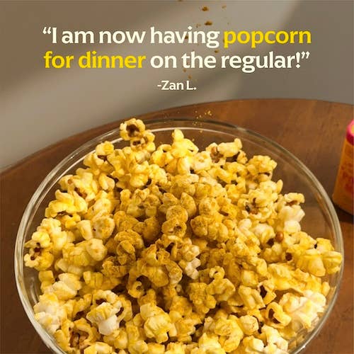 Diaspora Co. Spices - Popcorn Masala in a bowl of popcorn, showcasing a gourmet spice blend ideal for enhancing your snacking experience.