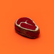 Ware of the Dog - Boiled Wool Steak Dog Toy, a handmade felted lambswool toy crafted in Nepal, providing fair-trade employment to local craftswomen.