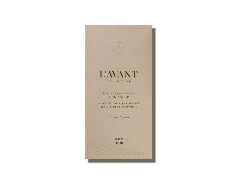 L’AVANT Collective - Hand Soap Ambre Santal box, featuring gold-foil text, highlights eco-luxe plant-based ingredients in a reusable glass bottle.
