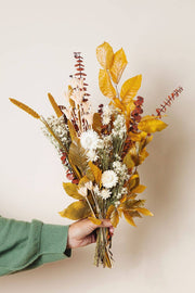 Idlewild Floral Co. - Golden Fall Market Bouquet, featuring dried leaves, eucalyptus, strawflowers, and grasses; a maintenance-free decorative piece for home ambiance.