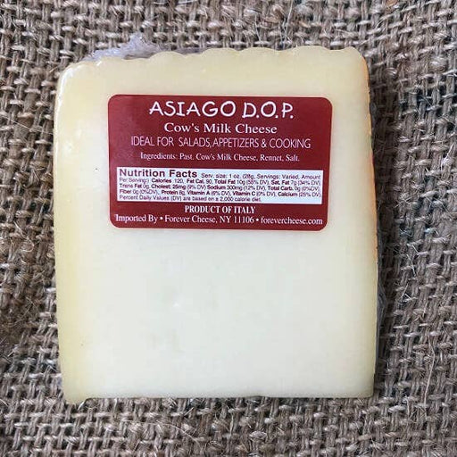 Nicola's Marketplace - Asiago D’Allevo DOP Mitica®: 7 ounces wedge, semi-firm cow’s milk cheese from Italy with red label detailing ingredients and nutritional facts. Ideal for culinary use.
