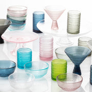 Fortessa | Jupiter Amber 10oz Double Old Fashioned Glass, featured among various glassware, showcasing its distinctive design suitable for elegant dining or bar settings.