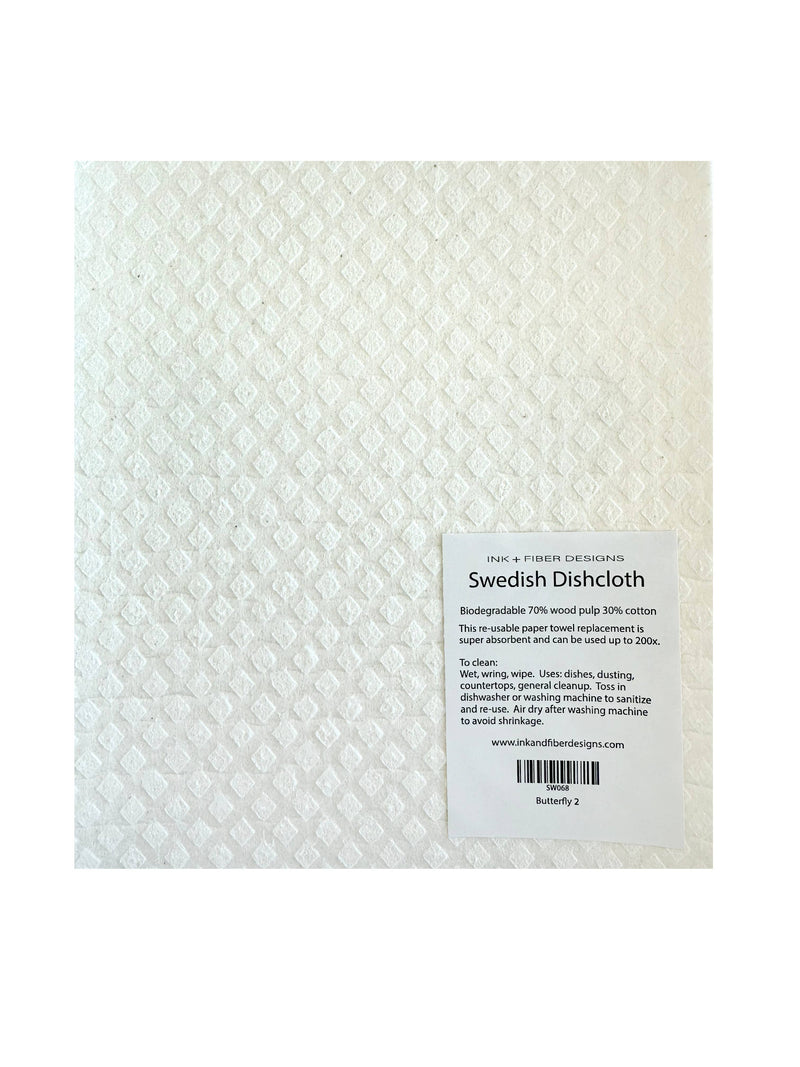 Ink and Fiber Designs - Butterfly 2 Swedish Dishcloth with a diamond pattern, featuring a black and white label and barcode on recyclable material.