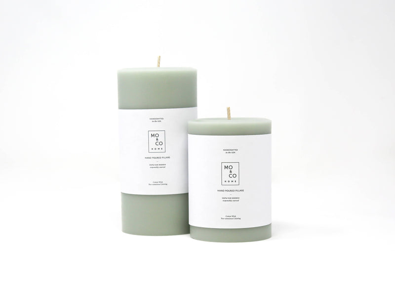 Mo&Co Home - 100% Beeswax Pillar Candles | Eucalyptus: 3x4 Inch. Hand-poured beeswax candles with white labels, showcasing sustainable, clean-burning design for home decor and celebrations.