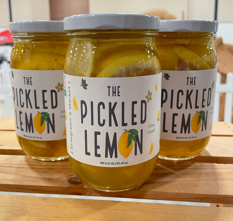 PICKLES by Evergreen and Market - The Pickled Lemon: Three jars of pickled lemons in brine, showcasing sweet, tangy, and sour flavors.