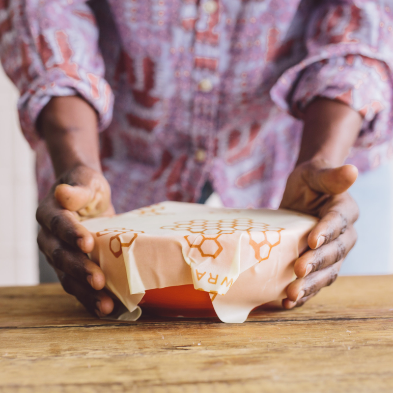 Bee's Wrap - Cut-to-Size Roll - Honeycomb held by a person, showcasing its flexible, reusable features for sustainable food storage.