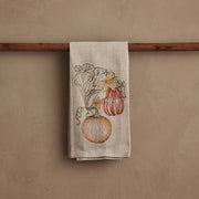 Coral & Tusk - Pumpkin Vine Tea Towel featuring embroidered pumpkins and blossoms, perfect for autumn kitchen decor. Measures 25 × 18 unfolded.