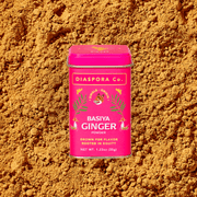 Diaspora Co. Spices - Basiya Ginger in a pink container with a white lid and tiger illustration, highlighting its culinary and medicinal use.