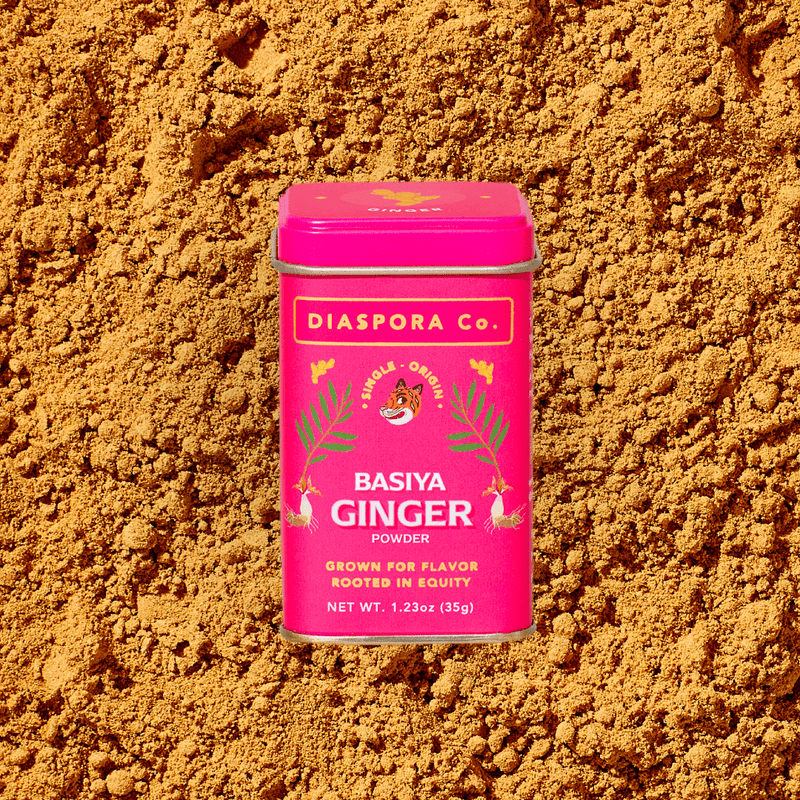 Diaspora Co. Spices - Basiya Ginger in a pink container with a white lid and tiger illustration, highlighting its culinary and medicinal use.