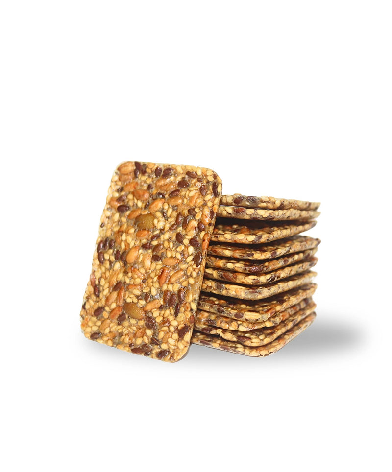 Top Seedz - 6 Seed Crackers (Grain-Free) | 5oz boxes (12 per case), stacked with visible seeds, showcasing a light, crisp texture.