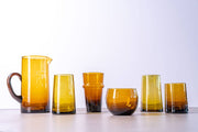 Moroccan Cone Glassware Small - Amber - Set of 6; hand-blown, cone-shaped glasses with visible bubbles, perfect for beverages or vases, crafted from recycled bottles.