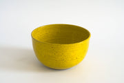 RachaelPots - Laura Bowl: Light Blue, a hand-thrown, bright yellow ceramic bowl with speckled flecks, ideal for versatile meals.
