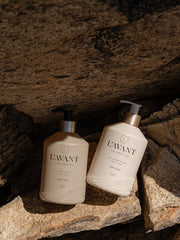 L'AVANT Collective - Hand Soap Ambre Santal in sculptural pump bottle, nestled on stone, with subtle woven-textured band and metallic-tone collar, from Athens Cooks' curated collection.