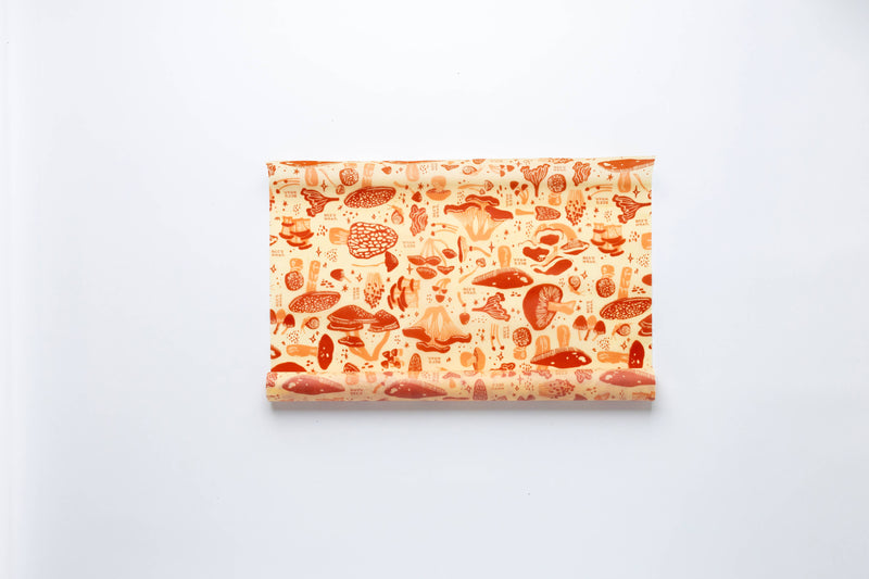 Bee's Wrap - Cut-to-Size Roll - Mushroom Magic, Limited Edition Print, featuring mushroom motifs for customizable, sustainable kitchen use. Reusable, compostable, and perfect for diverse food storage needs.
