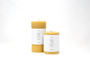 Mo&Co Home - 100% Beeswax Pillar Candles, Natural Gold, 3x6 Inch, pair with white labels, showcasing eco-conscious, hand-poured craftsmanship.