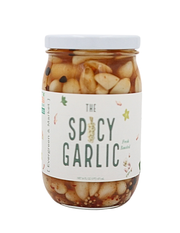 The Spicy Garlic by Evergreen and Market: A 16 oz glass jar of pickled garlic cloves in oil with chili flakes, mustard seeds, and spices.