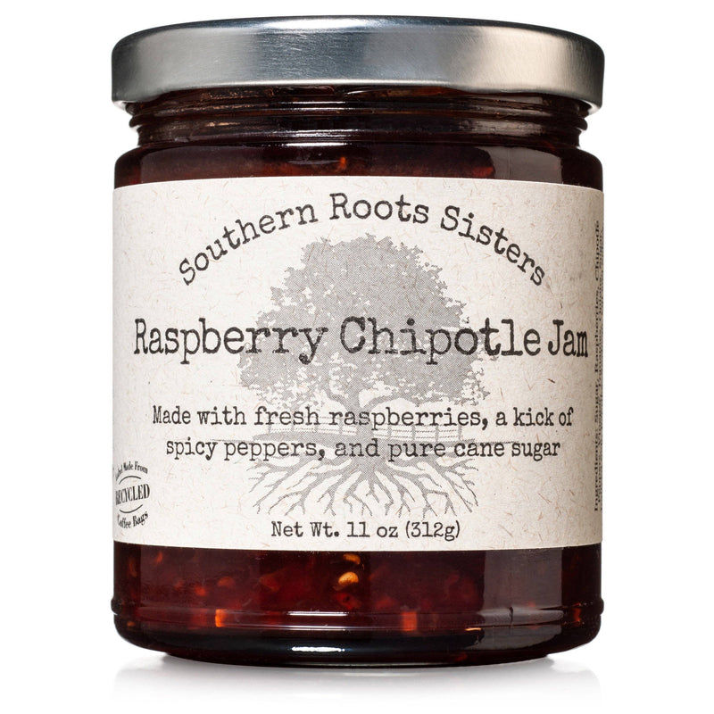 Southern Roots Sisters Raspberry Chipotle Jam in a glass jar, featuring fresh raspberries and spicy chipotle peppers, ideal for cheeses, meats, and desserts.
