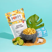 Poppy Hand-Crafted Popcorn - Mexican Street Corn Popcorn with limes and bag of tickets, offering a spicy, tangy snack experience.