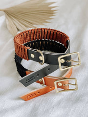 EMBER & IVORY - Black/Rust WIDE Leather & Macrame Collar: Small, featuring woven and leather elements with brass fittings, styled on textured cloth.