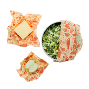 Bee's Wrap - Assorted 3 Pack - Mushroom Magic, Limited Edition, showcasing wraps with cheese, greens, and apple. Sustainable, reusable food wrap from Athens Cooks.