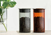 HARIO USA - HARIO Colors Glass Canister, 400ml: Amber, featuring heatproof glass and silicone seal, stores coffee beans stylishly, enhancing your kitchen's functionality and aesthetics.