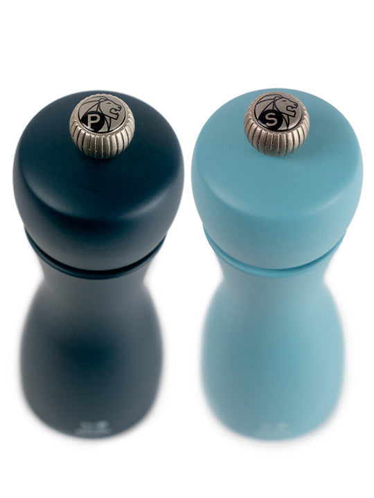 Peugeot | Tahiti Duo Salt + Pepper Mills, Air, featuring a classic hourglass shape in matching dark and light blue for stylish kitchen aesthetics.