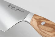 Wüsthof Amici 7 Santoku knife, featuring a sharp blade, ideal for precision cutting, displayed on a wooden surface, representative of Athens Cooks' quality kitchen tools.